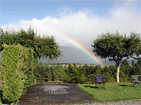 A rainbow over Fiordland Great Views Holiday Park