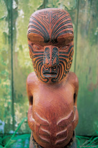 Image Source: Tourism New Zealand. Māori Carved Figure with Moko, New Zealand