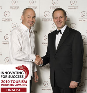 Prime Minister John Key congratulates New Zealand Tourism Guide Website Manager Aidan Rooney for NZTG becoming a finalist in the New Zealand Tourism Awards