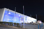 The Snowplanet building lit up at night