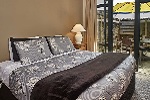 A bedroom at the Woolshed Apartments
