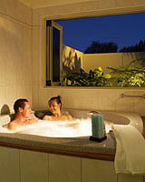 A couple relaxing in the spa bath