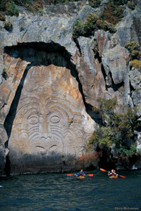 Image Source: Tourism New Zealand. Carvings at Mine Bay, Lake Taupo, Taupo, New Zealand
